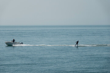 water skier and boat on a calm sea in the English channel