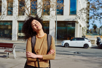 Fototapeta premium Cute young woman standing with her eyes closed