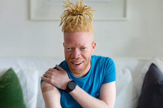 Happy African American Albino Man With Plaster After Vaccination