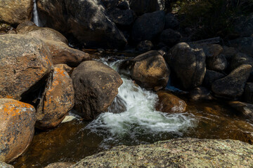 Naklejka na ściany i meble Beautiful stream rushing down a steep incline along Guanella pass road in Colorado