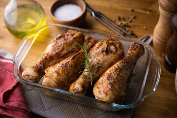baked chiken drumsticks in glass plates