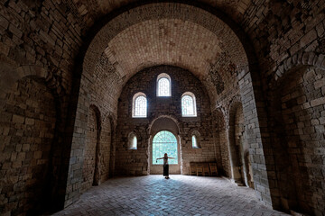 San Juan de la Peña, Aragon September 7, 2021, tourist inside the arched interior of the monastery of San Juan de la Peña, a Romanesque work in Huesca.