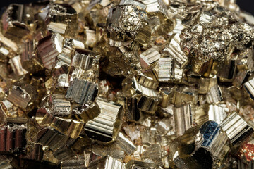 Macro mineral stone Pyrite on a black background