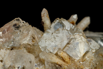 Macro mineral stone fluorite with quartz against black background