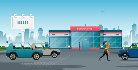 A woman brings her belongings to the parking lot after shopping at the supermarket. © intararit