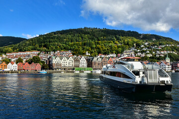 Fototapeta na wymiar ship and typical old buildings in Bryggen district in Bergen, a beautiful city in Norway