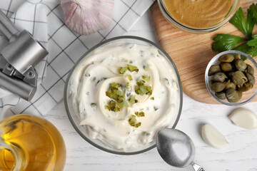 Tasty tartar sauce and ingredients on white wooden table, flat lay