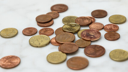 Pile of different cents coins in bright light
