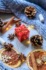 A New Year's gift and a garland with oranges . Christmas and New Year gifts. Holiday. Holiday decorations.