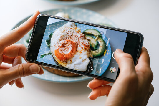 Taking picture of food with smartphone.