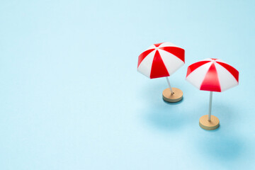 Fototapeta premium Red umbrella on a blue background.