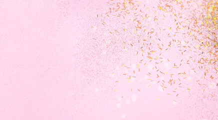 Abstract Pink background with gold sparkles. Creative space for design. Blurred effect