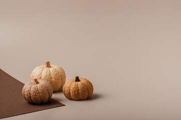 Flat lay with handmade painted gypsum pumpkins and copy space. Autumn holidays, thanksgiving,...