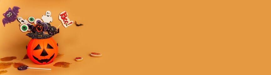 Banner Halloween candy bag pumpkin with gingerbread cookies in the shape of scary eye bats ghosts