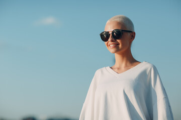 Portrait of young smiling millenial european short haired woman in sunglasses. Beautiful happy...