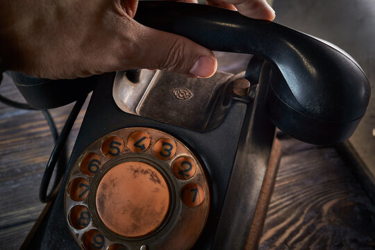 Classic telephone vintage color, dialing or scrolling phone on wooden table