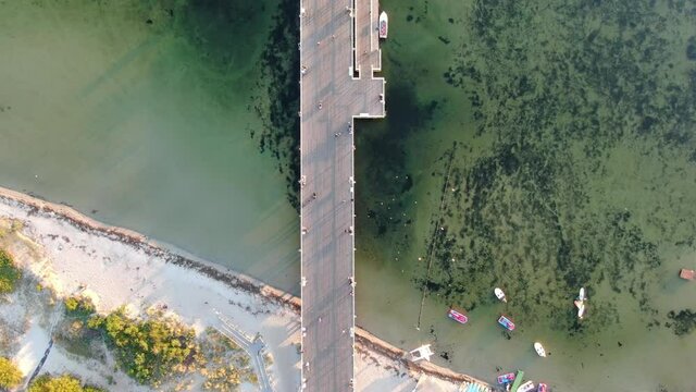 Flying over the pier in Jastarnia on Hel peninsula at the Baltic Sea in Poland