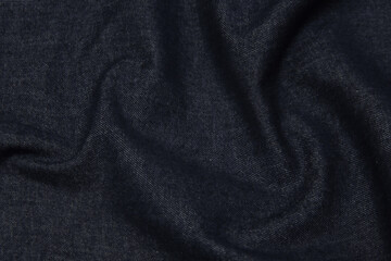Fototapeta na wymiar Cotton or wool fabric denim. Dark gray or black color. Texture, background, pattern.