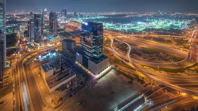 Aerial view of media city and al barsha heights district area night timelapse from Dubai marina.