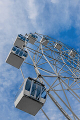 ferris wheel over the blue sky