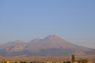 Fototapeta premium Huge mountain of Hasan mountain (hasan dagi) and sunset during and shadows on mountain peak.