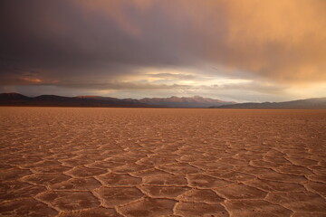 storm at salt flat desert on sunset