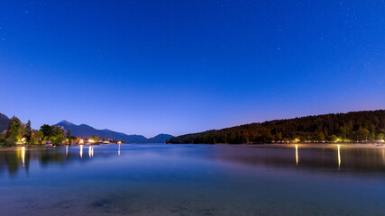 Fototapeta na wymiar Mountain lake Walchensee in Bavaria, Germany at night with stars in sky