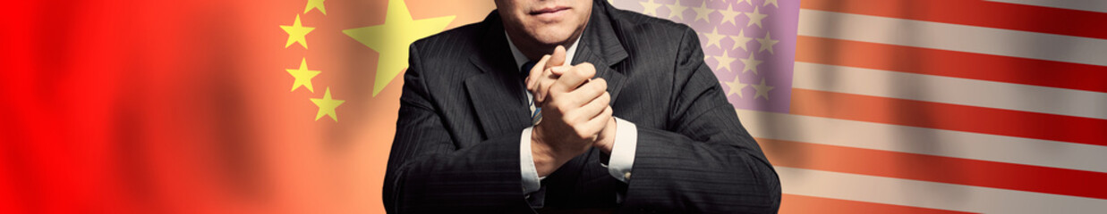 American and Chinese flag background and politician or business man