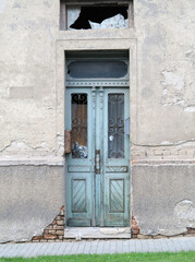Weathered wooden door in old ruin building
