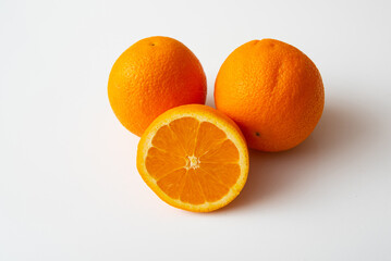 Sliced orange fruit segments isolated on white background