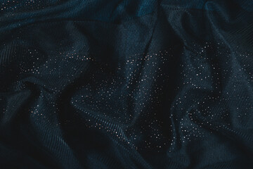 Dark green fabric with sequins