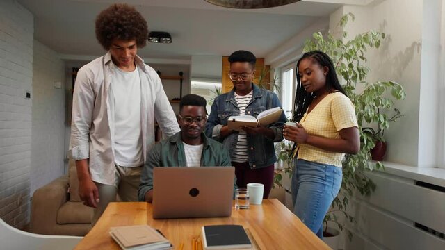 Four black young people brainstoming during worktime