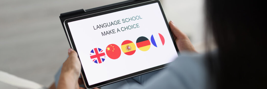 Woman holds tablet and chooses a foreign language to study