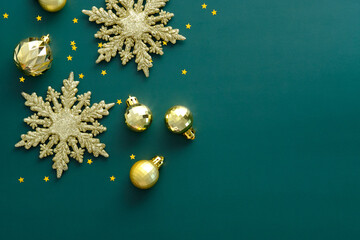 Vintage Christmas background with golden balls decoration, snowflakes, confetti. Retro Christmas...