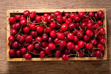 fresh ripe cherries in a wooden box