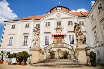Fototapeta premium Vranov nad dyji, Southern Moravia, Czech Republic, 03 July 2021: entrance to baroque and gothic medieval castle on hill at sunny summer day, courtyard with antique statues, stairs next to fountain