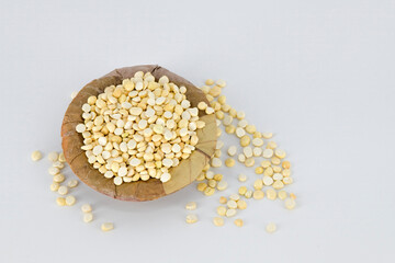 Selective focused Indian crispy salted fried and roasted Bengal gram or channa dal. Also called pori kadalai , pottu kadalai on isolated white background very healthy daily snacks