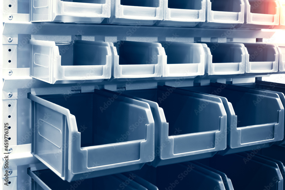 Poster rows of multicolored plastic boxes for components