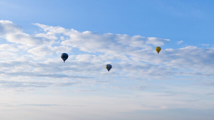 How to travel during quarantine. Hot air balloon. Colorful hot-air balloons flying over the fields