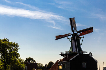 Fototapeta na wymiar Dutch windmill in Zaanse Schans, Zaandam, Netherlands