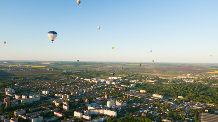 How to travel during quarantine. Hot air balloon. Colorful hot-air balloons flying over the city