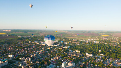 How to travel during quarantine. Hot air balloon. Colorful hot-air balloons flying over the city