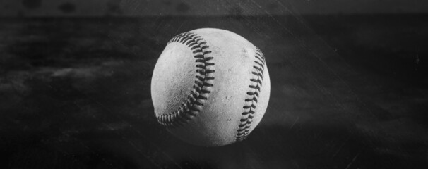 Old texture of sports ball shows baseball nostalgia banner in black and white.