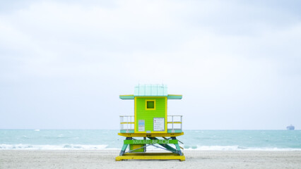 One of the iconic lifeguard towers of Miami Beach, this one in green, blue, and yellow.