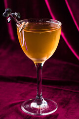 Alcoholic cocktail with orange syrup decorated