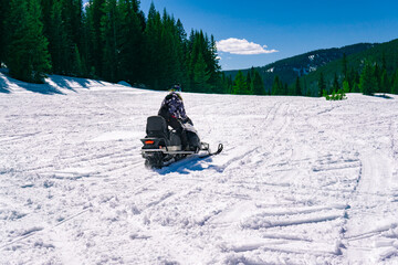 Snowmobile Rider In Winter Playground Wilderness Forest