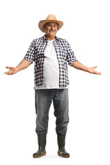 Full length portrait of a smiling mature farmer with a straw hat gesturing with hands