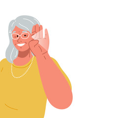 The old lady smiles and holds her hand near her ear.The elderly woman listening or hearing intently.