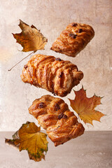 maple syrup buns and autumn leaves flying food