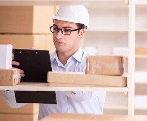 Man working in postal parcel delivery service office